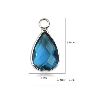 Blue teardrop birthstone pendant detail showing 14mm x 8mm size and 0.3g weight