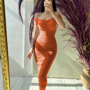 Detail of orange ruched off-shoulder maxi dress showing elastic knit texture and slim fit
