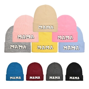 Grid display of Mama knitted beanies in various colors with high-quality embroidery