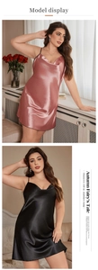 Detail view of satin silk spaghetti strap sleepwear in pink and black glossy fabric