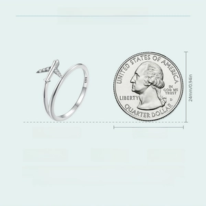 Detail of S925 sterling silver airplane ring showing 1.6g weight and size relative to a coin