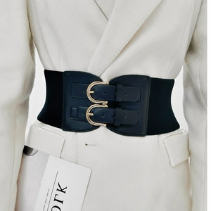 Women's wide elastic corset belt in black with double golden ring buckles on white blazer