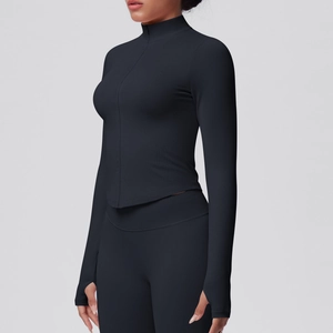 Detail of black yoga jacket showing thumbholes on sleeves and ribbed texture fabric