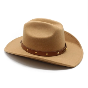 Close-up of khaki felt western cowboy hat with studded leather band and wide brim