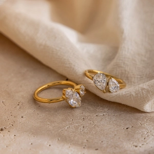 Macro view of 18K gold-plated rings featuring marquise and pear-shaped zircon stones