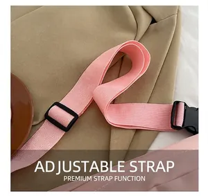 Detail of adjustable pink woven strap with durable black plastic buckle for chest bag