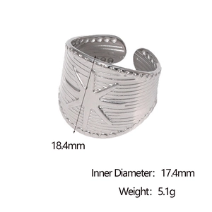 Detailed view showing wide silver star engraved ring band with 18.4mm width dimensions