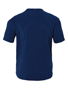 Detail view showing the geometric jacquard texture and navy blue fabric on the polo back