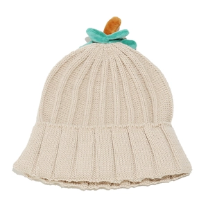 Detail of beige ribbed knit beanie with cute orange and teal sprout toppers