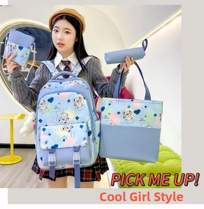 Light blue 4-piece school backpack set with cartoon bear patterns on a model