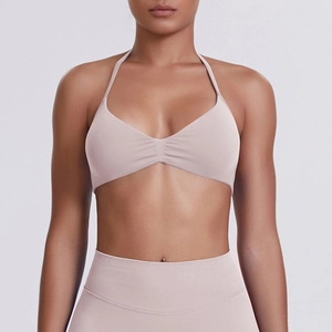 Detail of muted mauve seamless yoga set with halter sports bra and high waist leggings