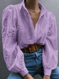Detail of purple lace-up lantern sleeves and intricate hollow embroidery on cotton shirt