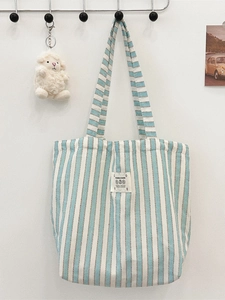 Vertical blue striped canvas tote bag with decorative patch and cute sheep keychain