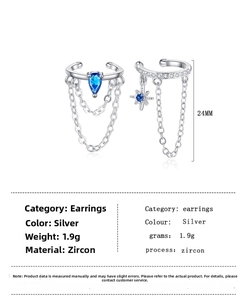 Gros plan sur les manchettes d'oreilles argentées avec gouttes en zircon bleu et chaîne