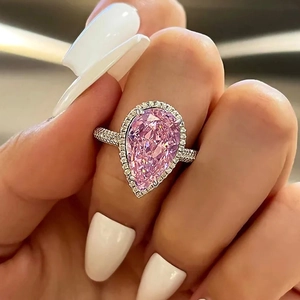 Luxury pear cut pink zircon ring with pave diamond band in silver-white finish