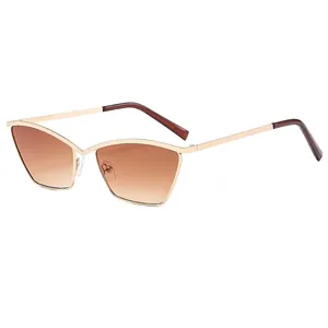 Fashion cat eye sunglasses with gold metal frame and brown gradient lenses on white