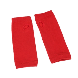 Detail of red knit arm warmer sleeves featuring ribbed cuffs and thumb hole design