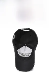 Detailed view of dark grey baseball cap interior featuring a 1982 patch and sweatband