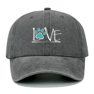 Close-up of dark grey washed cotton baseball cap featuring LOVE text and pet paw print