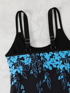 Detail view of floral tankini top featuring adjustable double straps and silver metal buckles