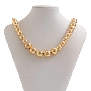 Detailed view of bold golden CCB bead necklace with graduated spherical spheres