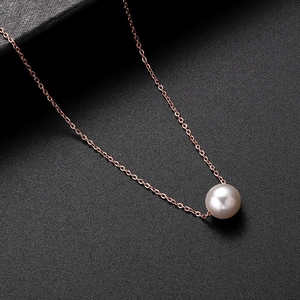 Elegant rose gold titanium steel necklace featuring a single round lustrous pearl pendant