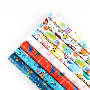Cartoon animal wrapping paper set featuring dinosaurs and giraffes for kids' birthdays