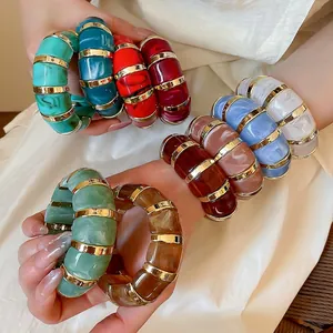 Chunky acrylic marble texture bangles with gold metal spacers in various colors