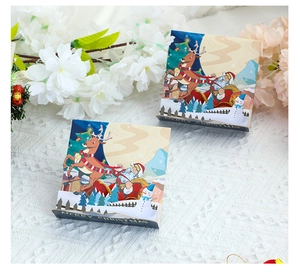 Detail of 3D pop-up Christmas cards featuring Santa and reindeer on white floral background
