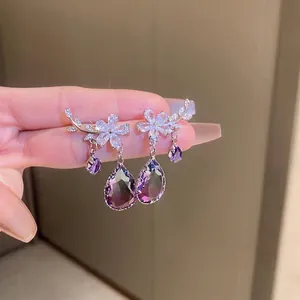 Elegant flower branch earrings with purple crystal pendants and sparkling zircons