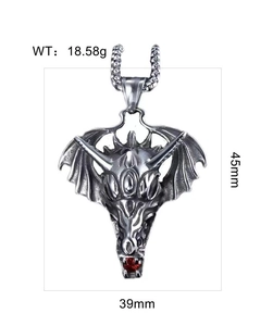Detail view of dragon wing pendant in antique silver with red gem eyes and measurements