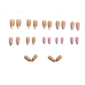 Star pattern gradient press-on nails set in almond shape with French tips and 3D details