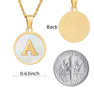 Detailed macro view of 18k gold letter A pendant with shell inlay and back view dimensions