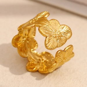 Macro shot of 18K gold plated ring featuring detailed radial texture on flower petals