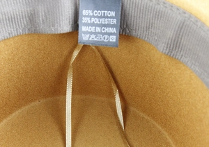 Close-up of inner label showing 65% cotton and 35% polyester fabric composition
