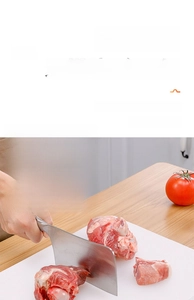 Macro shot of durable white solid PE cutting board showing meat chopping texture