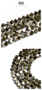 Macro detail of cubic pyrite beads with a metallic finish for jewelry making
