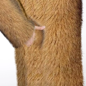 Close-up detail of high-density brown faux fur coat showing texture and pocket
