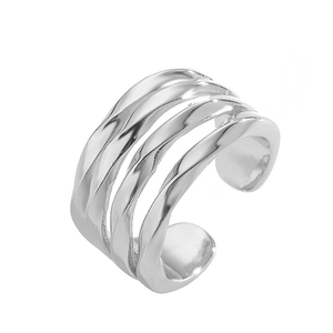 Macro detail of the silver multilayered twisted metal ring with a polished mirror finish