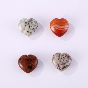 Macro shot of heart-shaped natural crystal stones with unique marble textures and colors