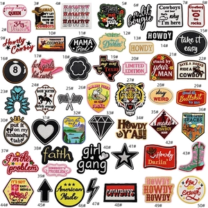 Detailed grid of 50 varied western cowboy embroidered patches including cactus and floral