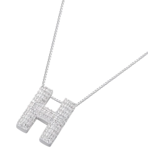 Macro detail of silver letter H pendant necklace with micro-paved cubic zirconia stones