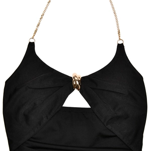 Detail of black halter dress featuring metallic gold chain straps and O-ring accents