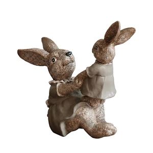 Resin parent-child bunny figurine with vintage texture and detailed fur carving on white background