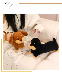 Detailed view of plush dachshund dog toys with soft fabric and cute bead eyes on a sofa