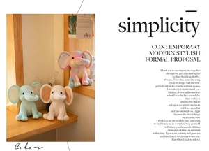 Detailed view of plush elephant dolls in mint green, white, and rainbow tie-dye colors