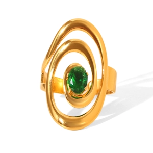 Macro shot of gold layered ring featuring a faceted oval green gemstone center
