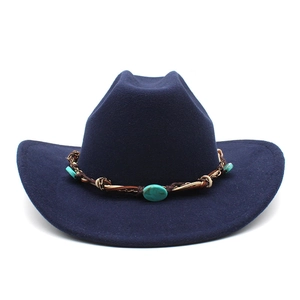 Detail of navy felt cowboy hat featuring leather band with turquoise stone accents