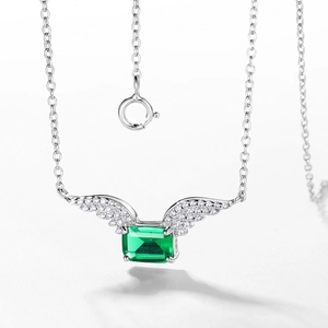 Elegant S925 silver necklace with green emerald pendant and sparkling angel wings