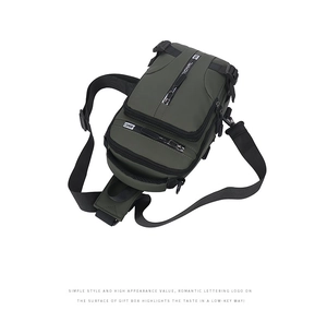 Close-up of army green waterproof nylon chest bag with multi-layer zipper pockets and buckle